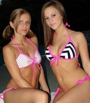 Young lesbians take off their bikinis in a safe for work manner at night on modelies.com