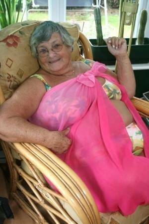 Horny old granny in glasses disrobes to reveal huge saggy tits & big BBW ass on modelies.com