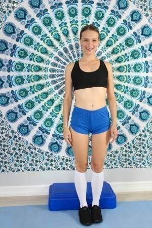 Athletic college girl Izzy Lush gets naked in white knee socks & black runners on modelies.com