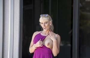 Naughty blonde flashes no panty upskirts and her big tits out in public on modelies.com
