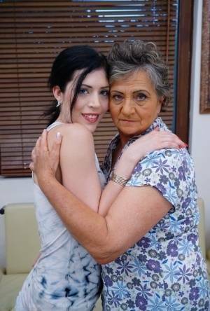 Lesbian granny worshipping sexy teen's attractive body and holes on modelies.com