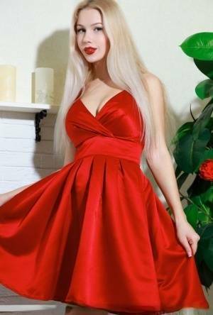 Nice blonde teen Genevieve Gandi removes red dress to display her trimmed muff on modelies.com