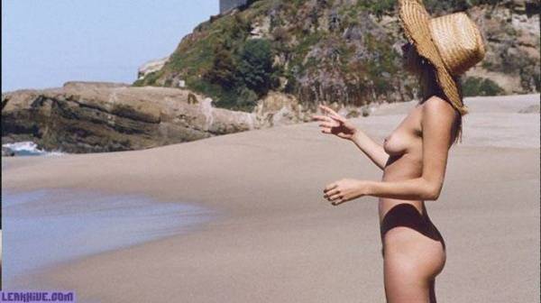 Camille Rowe nude on the beach on modelies.com