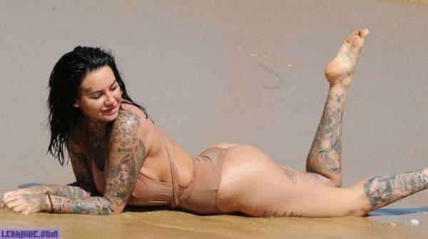 Jemma Lucy showing her ass and cleavage on the beach on modelies.com