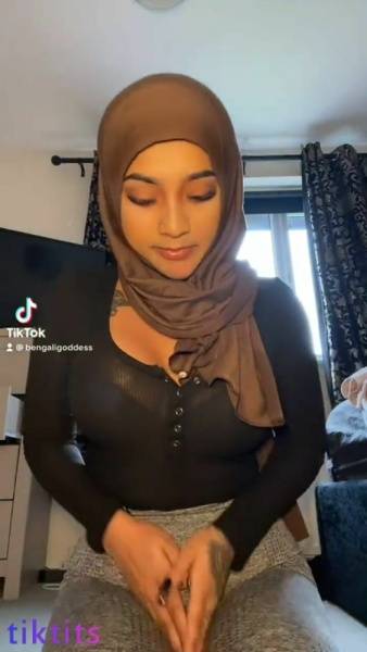 Arab Tik Tok girl 21+ can not hide her sexy tattooed body under the hijab nsfw on modelies.com