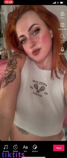 Redheaded bitch with pretty freckles showed her size 34H TikTok tits on modelies.com