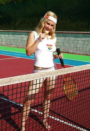Sporty babe with big tits Angel B toying her cunt on the tennis court on modelies.com