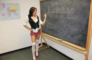 Naughty schoolgirl Cherry Poppins seduces a fellow student in slut wear on modelies.com
