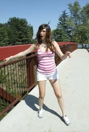 Flexible babe in shorts Holly Michaels shows her sports body outdoor on modelies.com
