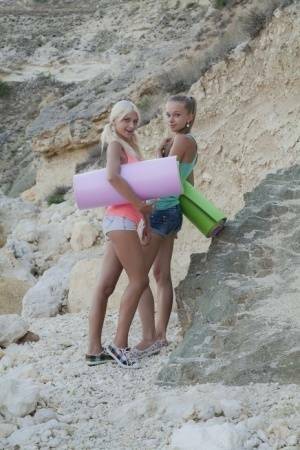 Young hotties Nika N & Milena D head to the hills for lesbian sex on yoga mats on modelies.com