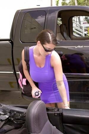 Linsey Dawn McKenzie shows her upskirt area in the car. on modelies.com