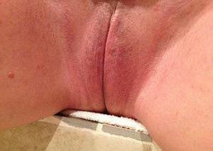 Older amateur Busty Bliss finger spreads her pink vagina after showering on modelies.com