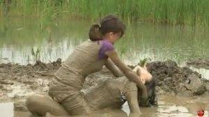 Two women have a romantic time in mud Thothub on modelies.com