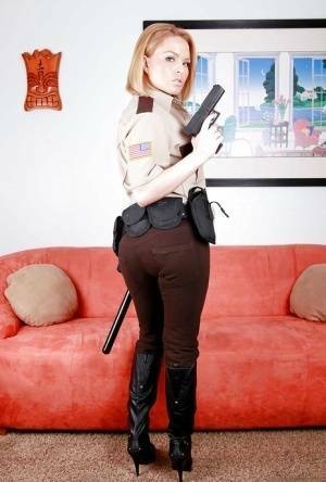 Hot babe in police uniform Krissy Lynn stripping and spreading her legs on modelies.com