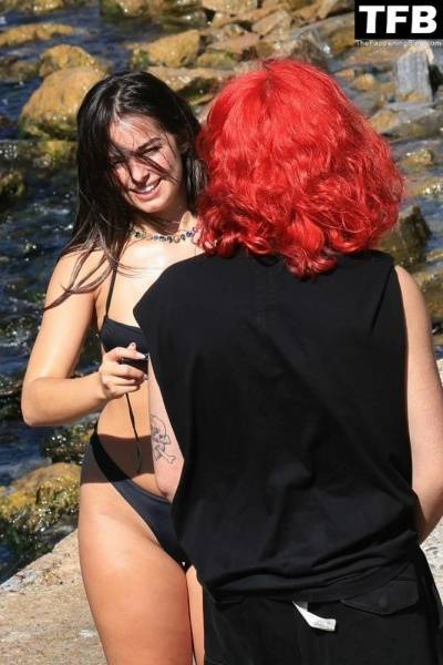 Addison Rae Displays Her Curves in a Black Bikini on Holiday with Omer Fedi on Lake Como on modelies.com