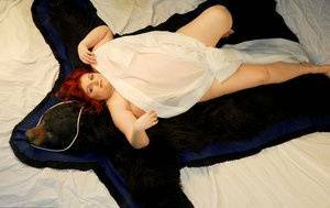 Fat redhead Black Widow AK models totally naked on a bearskin rug on modelies.com